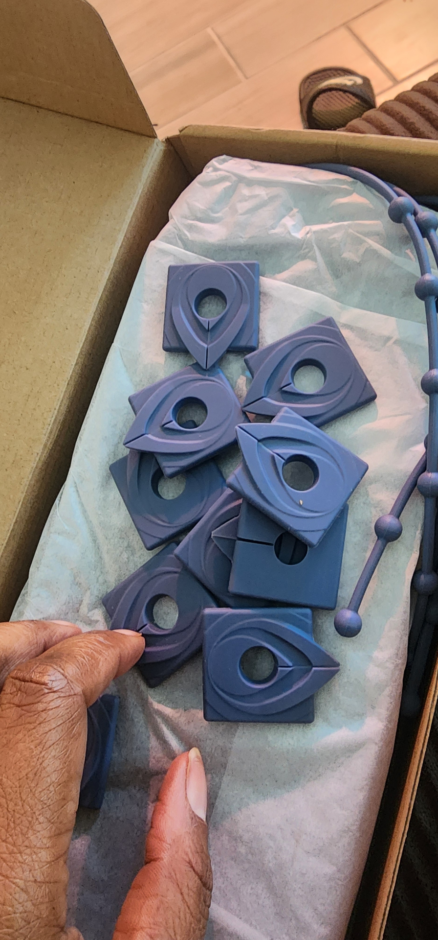 Blue Gardyn covers for unused openings in the box