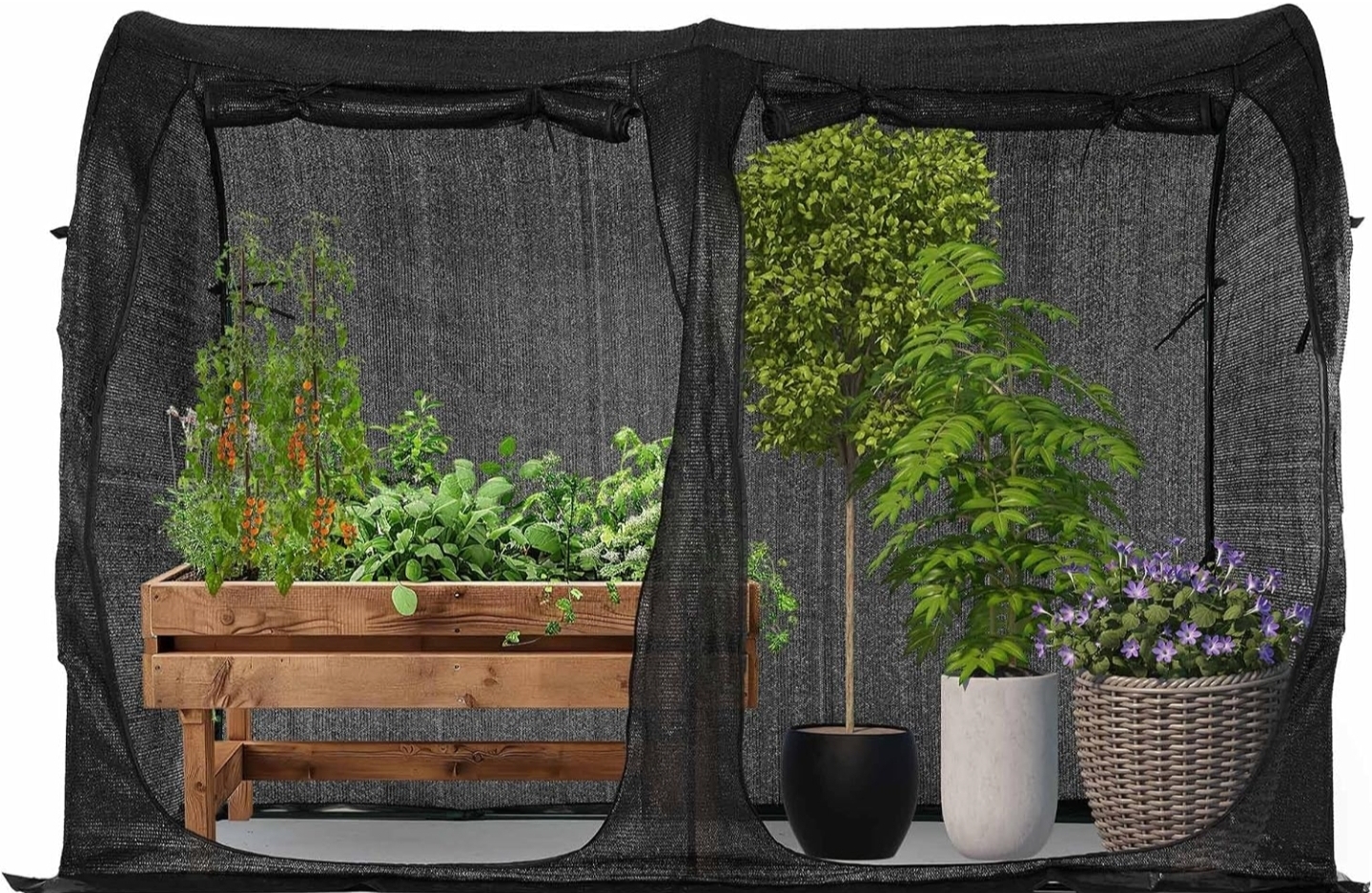 Lightweight black mesh tunnel-style shade cover over a raised garden bed with tomatoes, herbs, and potted plants